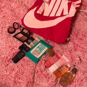 Cute pink Nike bag and an assortment of makeup!
